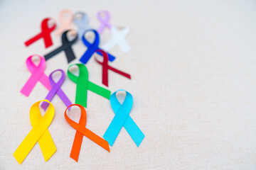 World cancer day, February 4. Colorful ribbons for supporting people living and illness....