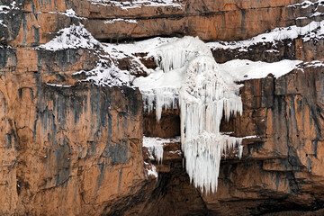 Frozen waterfall in the mountains