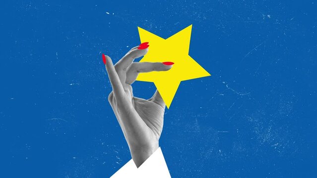 Stop motion, animation. Female hand holding big yellow star over blue background. Good luck symbol