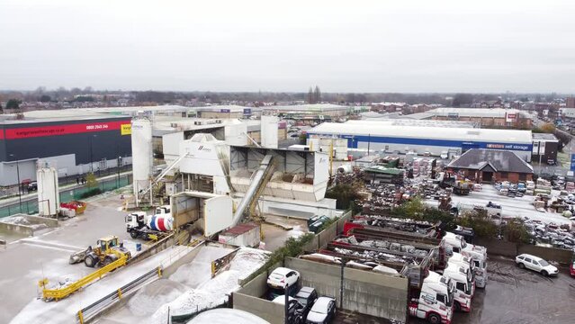 Industrial CEMEX concrete manufacturing factory yard aerial view with trucks parked around equipment