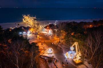 Christmas illuminations by the pier in Brzezno at dusk, Gdansk.  Poland.