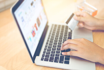 Woman paying online shopping with credit card