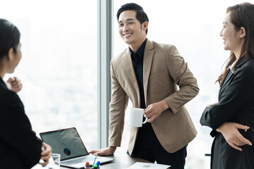 image of a group of Asian businessmen working together at the company
