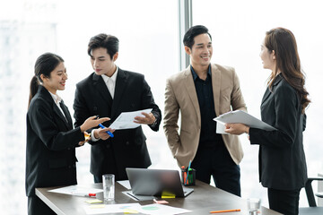 image of a group of Asian businessmen working together at the company