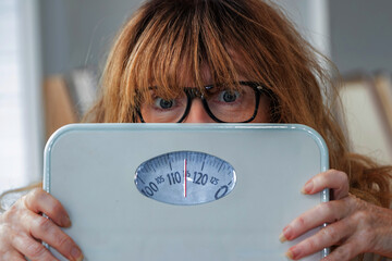 woman with weight scale, diet and health concept