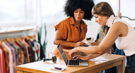 Thrift store owners preparing online orders fo shipping