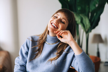 Female business professional smiling happily in an office