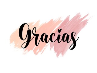 Gracias hand written lettering Thank you in Spanish language on abstract watercolor brushed background