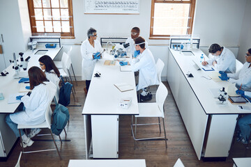 Education, science and students in lab classroom with professor and equipment for test. Technology,...