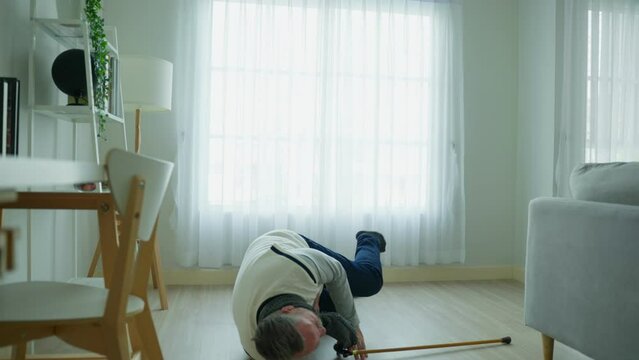 Caucasian senior man fall on the ground while walk with walker alone. 