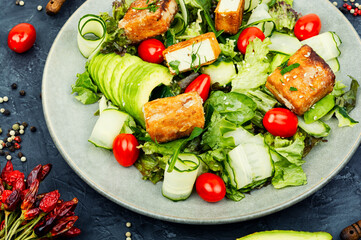 Salad of frying soy tofu and fresh vegetables.