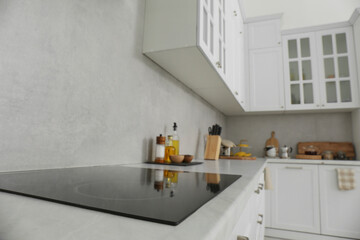 Obraz na płótnie Canvas Modern inductive cooktop in kitchen. Interior design