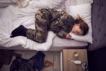 Depression, anxiety and woman soldier in bed with ptsd, trauma and pills for suicide, phobia and...