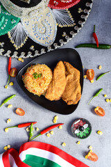 Obraz na płótnie Canvas Breaded chicken cutlets with jardinera mexican rice
