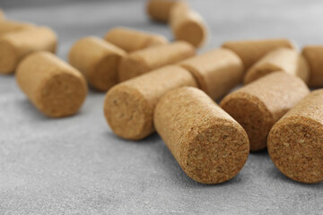 Wine bottle corks on light grey table, closeup
