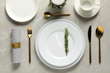 Beautiful table setting on light marble surface, flat lay