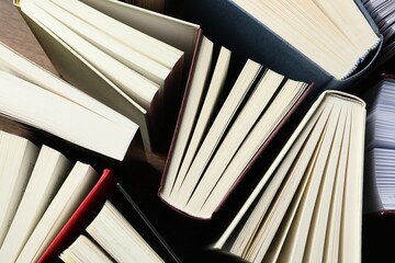 Many hardcover books as background, top view