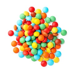 Many small colorful candies on white background, top view