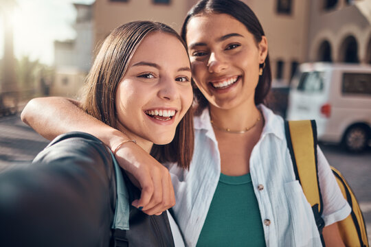 Selfie, smile and students on campus with a hug, excited for school and memory during education. Happy, university and face portrait of girl friends with a photo at college together with happiness