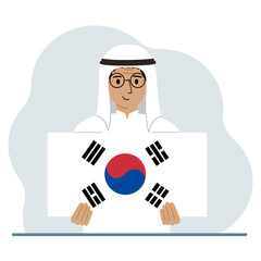 A man is holding the flag of South Korea. The concept of demonstration, national holiday, independence day or patriotism. Nationality.