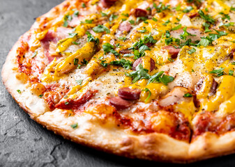 Pizza with Mozzarella cheese, backon, ham, tomato sauce, pepper, sausage