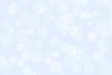 Abstract bokeh light snowfall background. Soft blue and white bokeh background. New Year, Christmas, Winter and all celebration background concept.