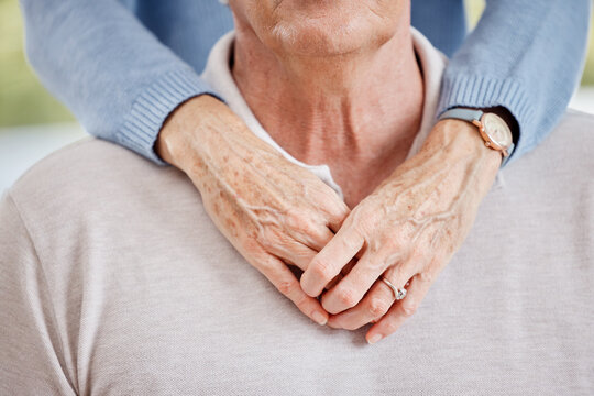 Closeup, married couple and senior hands hug partner in happy relationship of love, care or support together. Elderly man, old woman and pension people in retirement hugging for comfort, bond and age