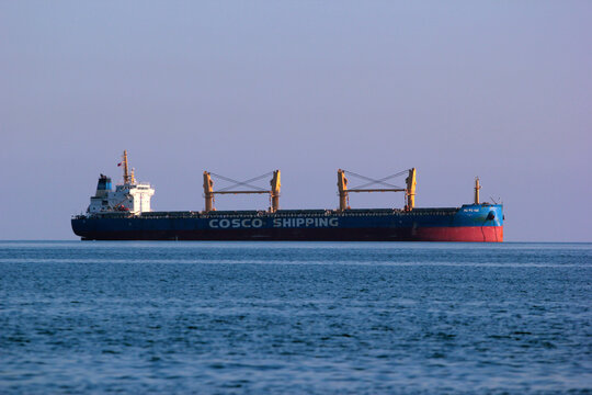 Antalya, Turkey - December 18, 2022: Large empty container ship of the COSCO Shipping Line near Antalya port
