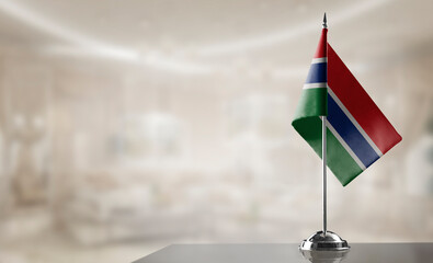 A small Gambia flag on an abstract blurry background