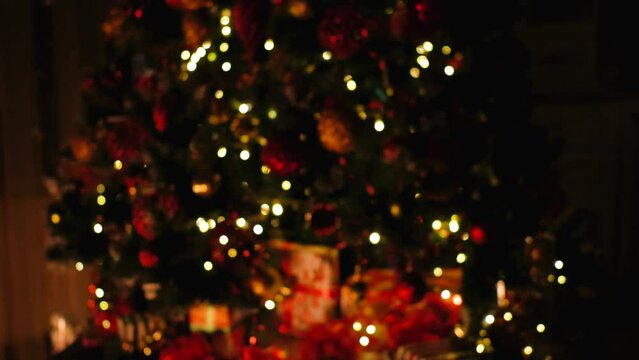Christmas tree lights with nice bokeh top to bottom slide. High quality 4k footage