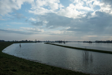 Fototapeta na wymiar Hig water in the river Lek in the Netherlands in winter