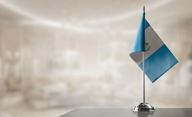 A small Guatemala flag on an abstract blurry background