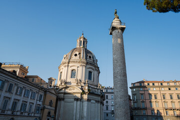 Trajan's Roman triumphal Column and Santa Maria di Loreto church in Rome, Italy.