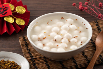 Little white tangyuan with sweet osmanthus honey and syrup soup.