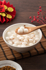 Fototapeta na wymiar Little white tangyuan with sweet osmanthus honey and syrup soup.