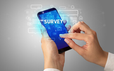 Hand using smartphone with social media concept