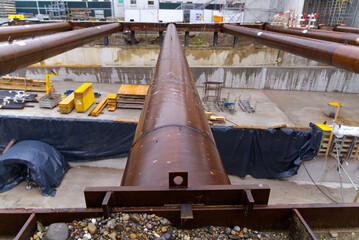 Open day at highway enclosure site with rusty iron tubes and subway at Zürich Schwamendingen on a...