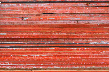 Open day at highway enclosure construction site with piled up red wooden planks on roof at Zürich...
