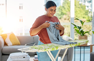 Woman, laundry and ironing board, cleaning service and domestic worker with happy, smile and...
