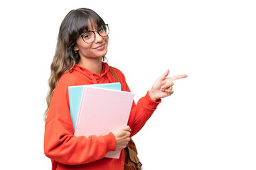 Young student caucasian woman over isolated background pointing finger to the side