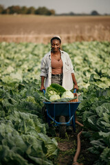 Agriculture black farmer working on a farm, countryside, or nature environment enjoying rustic, sustainable living lifestyle.