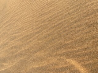Fototapeta na wymiar desert and sand waves and ripple background photo