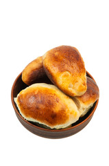 pies with apples in a clay bowl. the concept of home baking with yeast dough