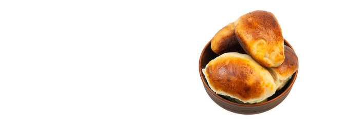 pies with apples in a clay bowl. the concept of home baking with yeast dough