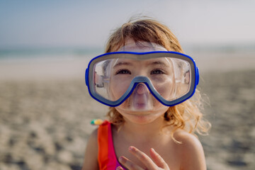 Portrait of little girl in snorkeling mask.