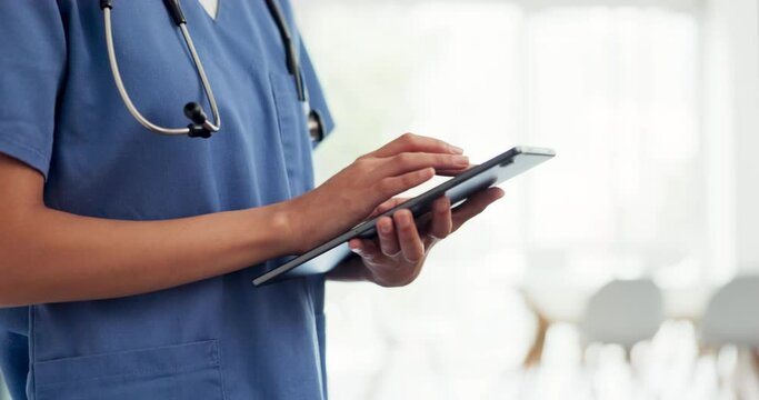Digital tablet, healthcare and doctor doing research in the hospital before a consultation. Technology, nurse or medical worker scrolling on mobile device to analyze test results in a medicare clinic