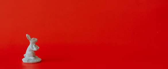 close up white rabbit model on red background with copy space for chinese happy new year celebrate 2023