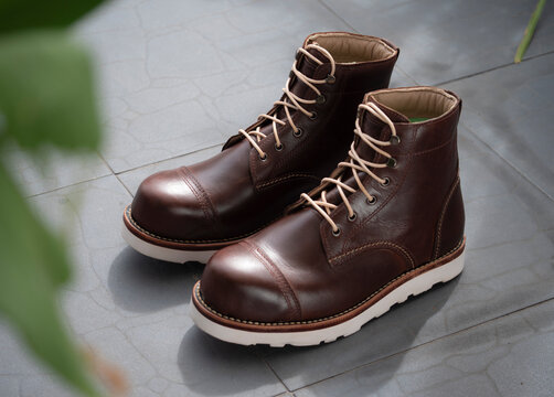 Men fashion brown boots leather on the floor.