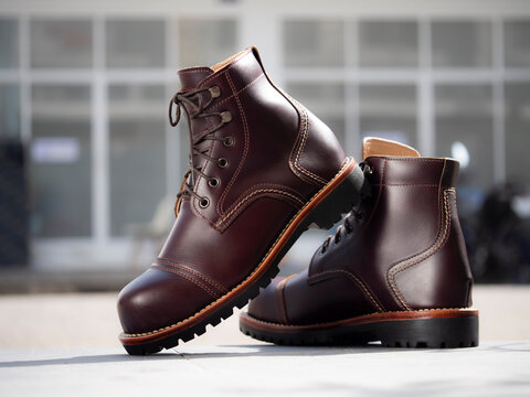 Man fashion brown boot leather on the floor.