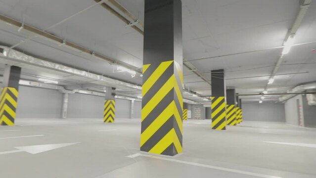 Modern empty underground parking. Empty underground parking. Bright modern car park